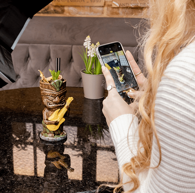 A woman taking a product image for her ecommerce business