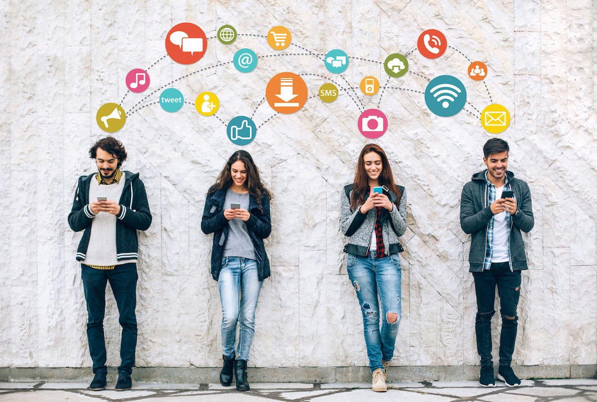 Four people standing against a wall on their social media accounts