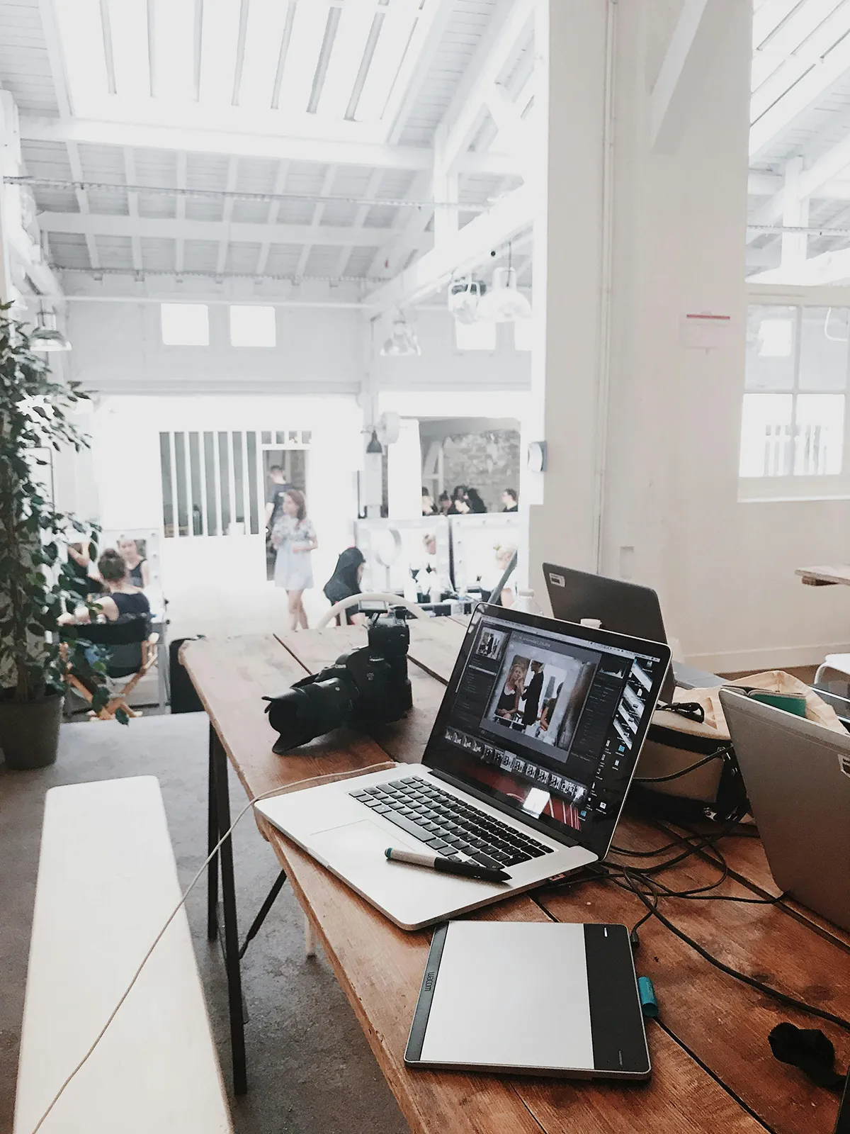 Digital marketing office showing a laptop and camera