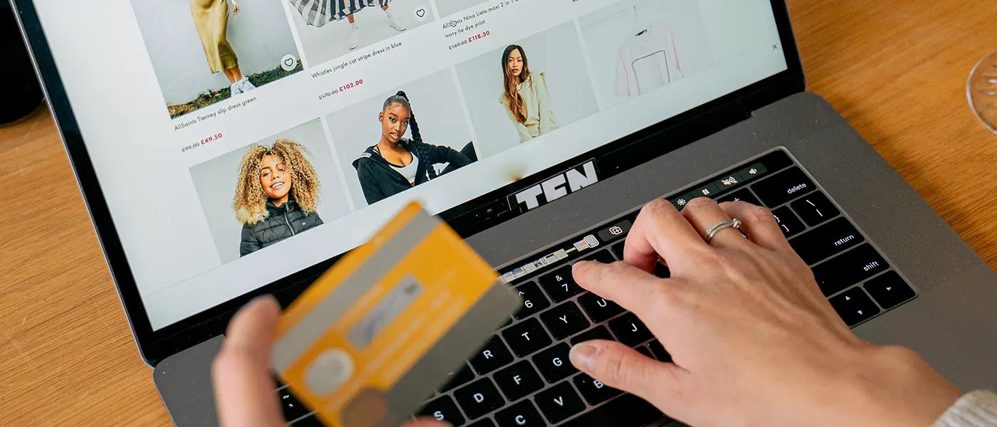 A woman paying for product on an e-commerce website